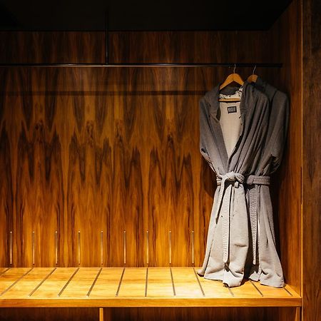 Macq 01 Hotel Hobart Exterior photo A bathrobe hanging on a wooden bench